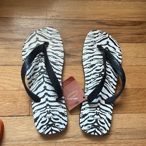 Brand new with tags Havaianas flip flops with zebra print. Sized 6.